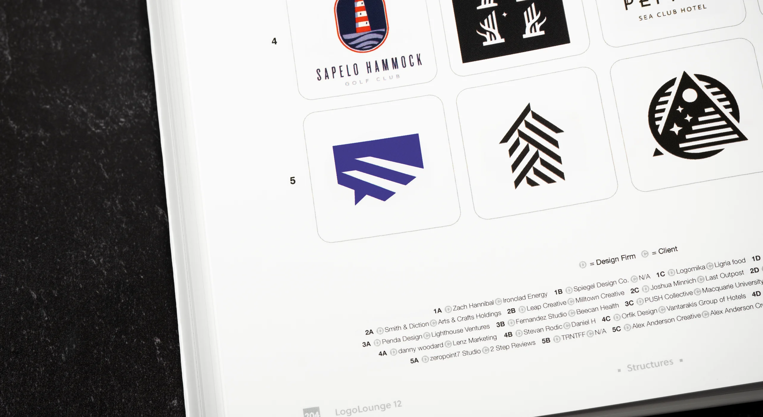 A photo of a book page showcasing an award-winning logo mark for 2 Step Reviews - an effective SaaS review management platform